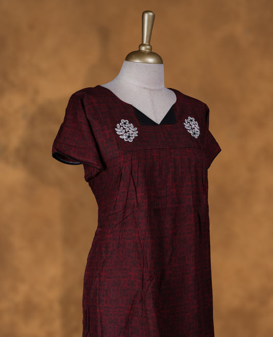 Dark red colour NStyle nighty featuring white floral thread on front & black patterns, a V-neckline, short sleeves, and a full ankle-length design.