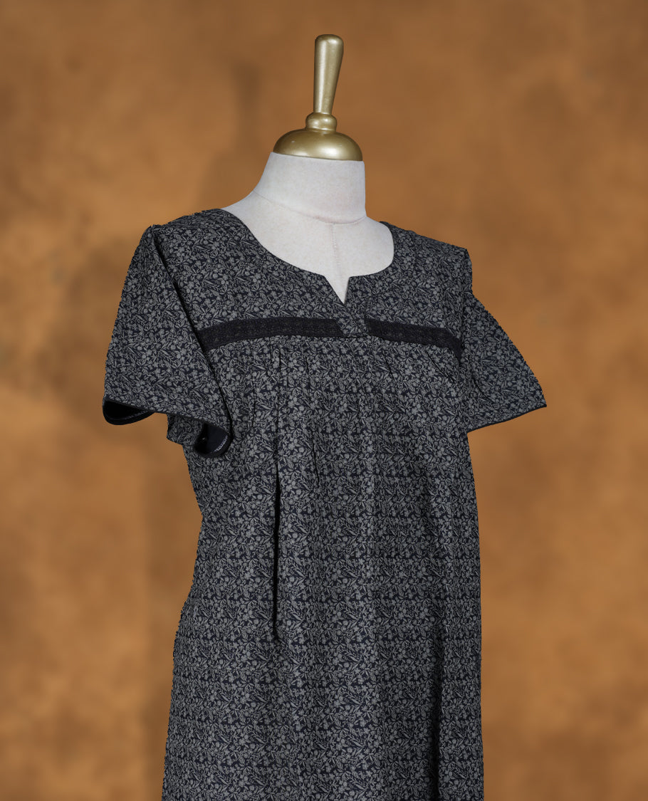 Black colour Nstyle nighty with featuring a gray floral pattern, a round with V-neckline with lace detailing, short sleeves, and a full-length