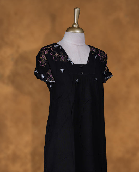 Black Colour NStyle nighty featuring purple and white floral patterns, a square neckline with button detailing, short sleeves, and a full ankle-length design.