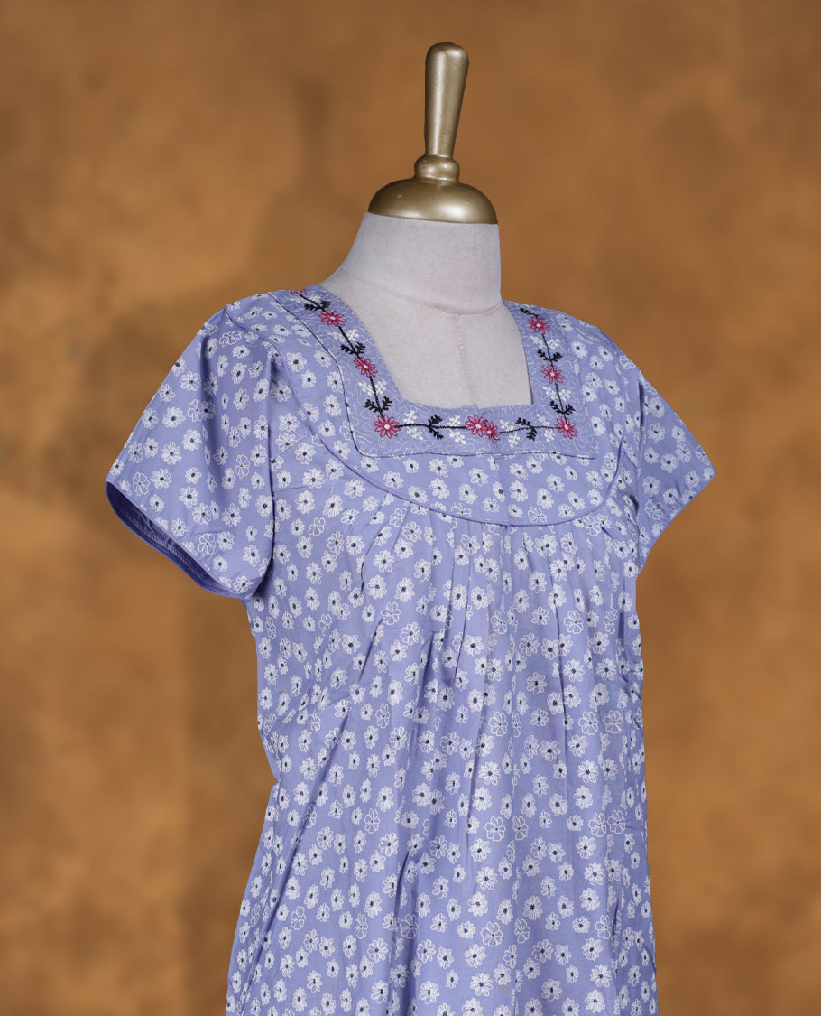 Light lavender colour NStyle nighty featuring White floral patterns, a Square neckline and thread pattern, short sleeves, and a full ankle-length design.