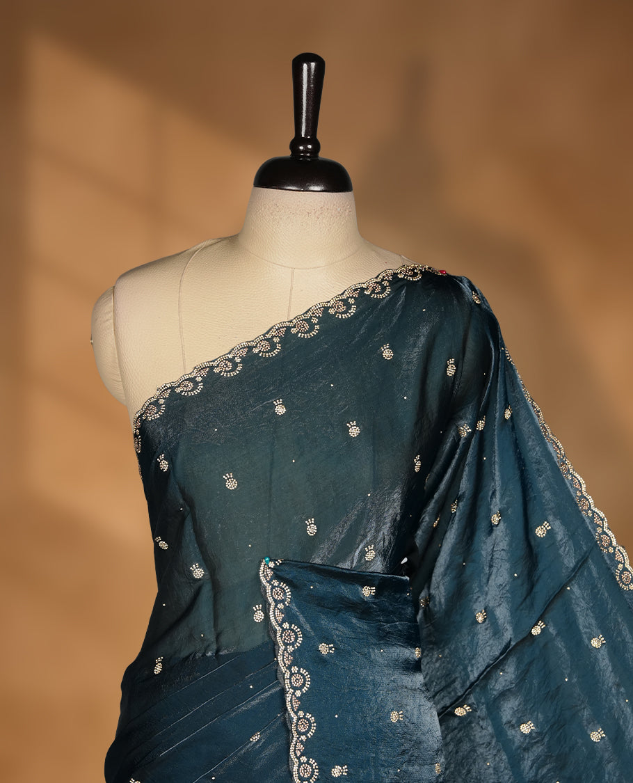 Peacock blue Colour velvet Chiffon Designer Saree featuring Delicate White Stone motifs on Body, with Stone Detailing on the Border and Pallu, paired with a Matching Blouse.