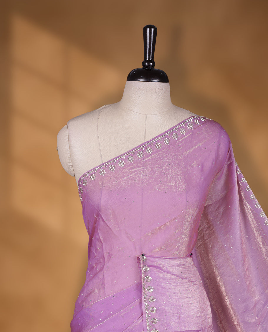 Lavender & pink double shade Colour net shimmer fancy saree adorned with scattered gold stone buttas all over the body, paired with a delicate stone worked border and matching blouse