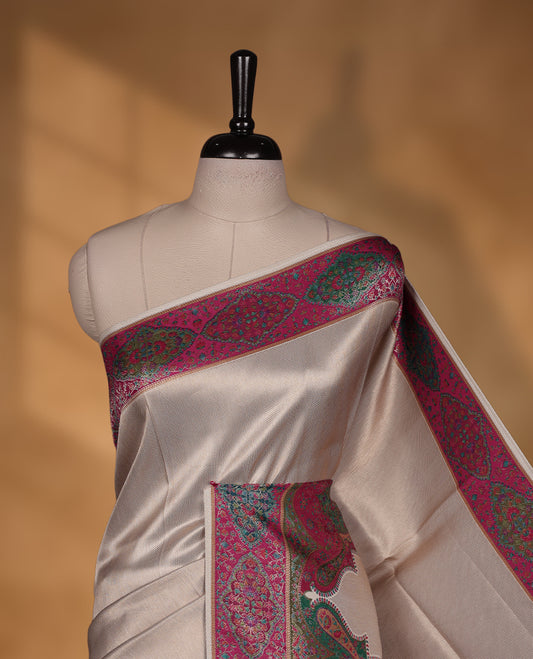 Beige colour Pashmina silk saree intricately woven with Mughal inspired garden scenes and figurative motifs across the body, framed by a rich maroon storytelling border and grand pallu, paired with a coordinated maroon woven jaal blouse piece (Copy)