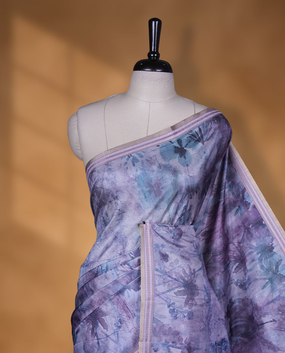 Lavender Purple colour semi tussar silk saree featuring an abstract digital floral printed body with a rich self border and tasselled pallu, paired with a matching blouse