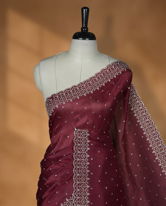 Maroon Colour Shimmer Designer Saree featuring Delicate White Stone Scattered Work on the Body, enhanced with Intricate Stone Detailing on the Border and Pallu, paired with a Matching Blouse.
