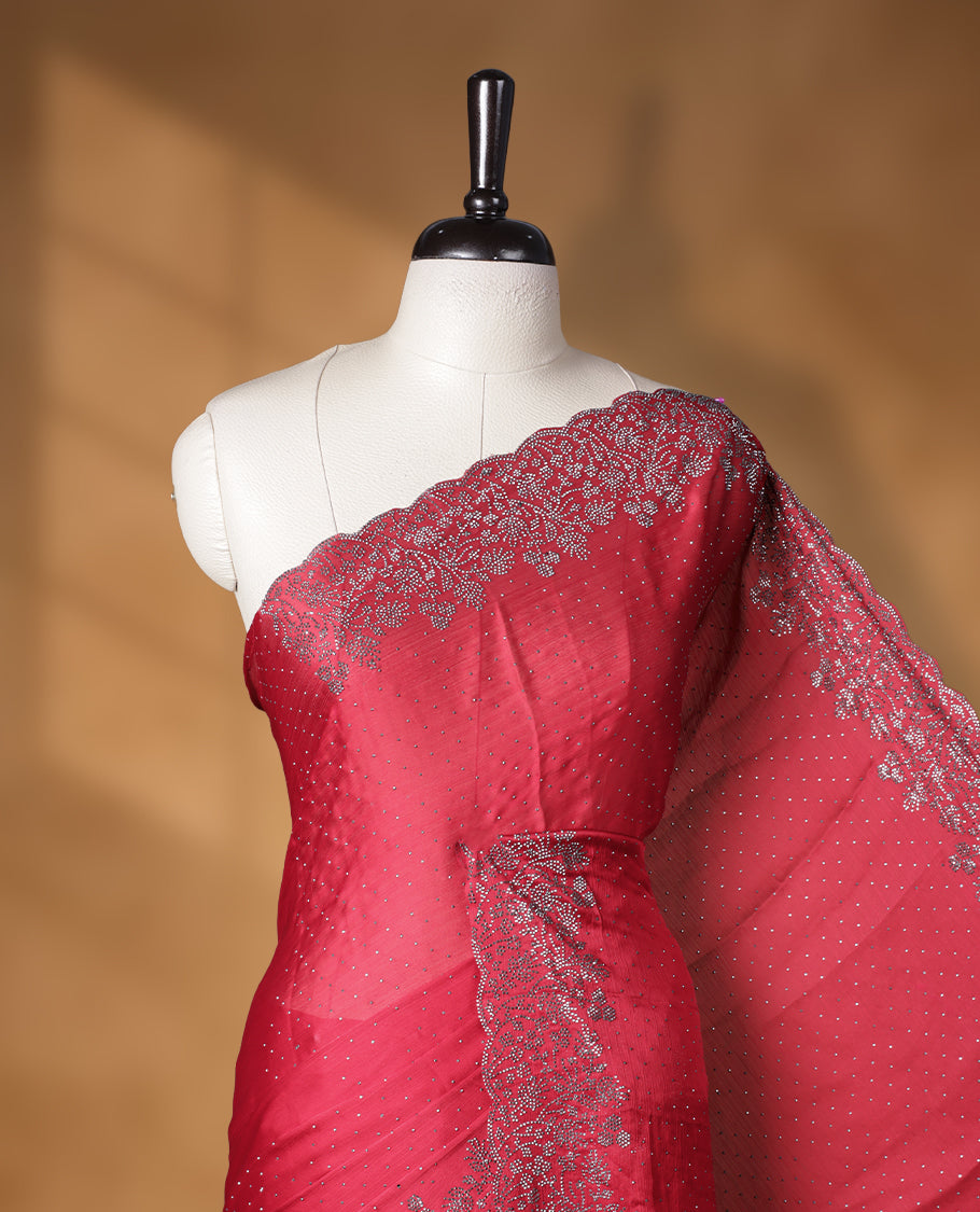 Red colour shimmer designer saree, featuring white scattered stone on body, stone work and heavy stone floral pattern on border and  pallu, Paired with matching blouse.