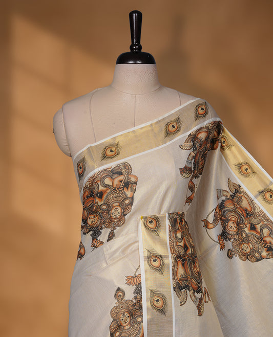Off-white colour with gold tissue Kerala saree featuring traditional mural-inspired prints, peacock-feather border detailing, and a classic gold kasavu pallu. Includes matching blouse piece.