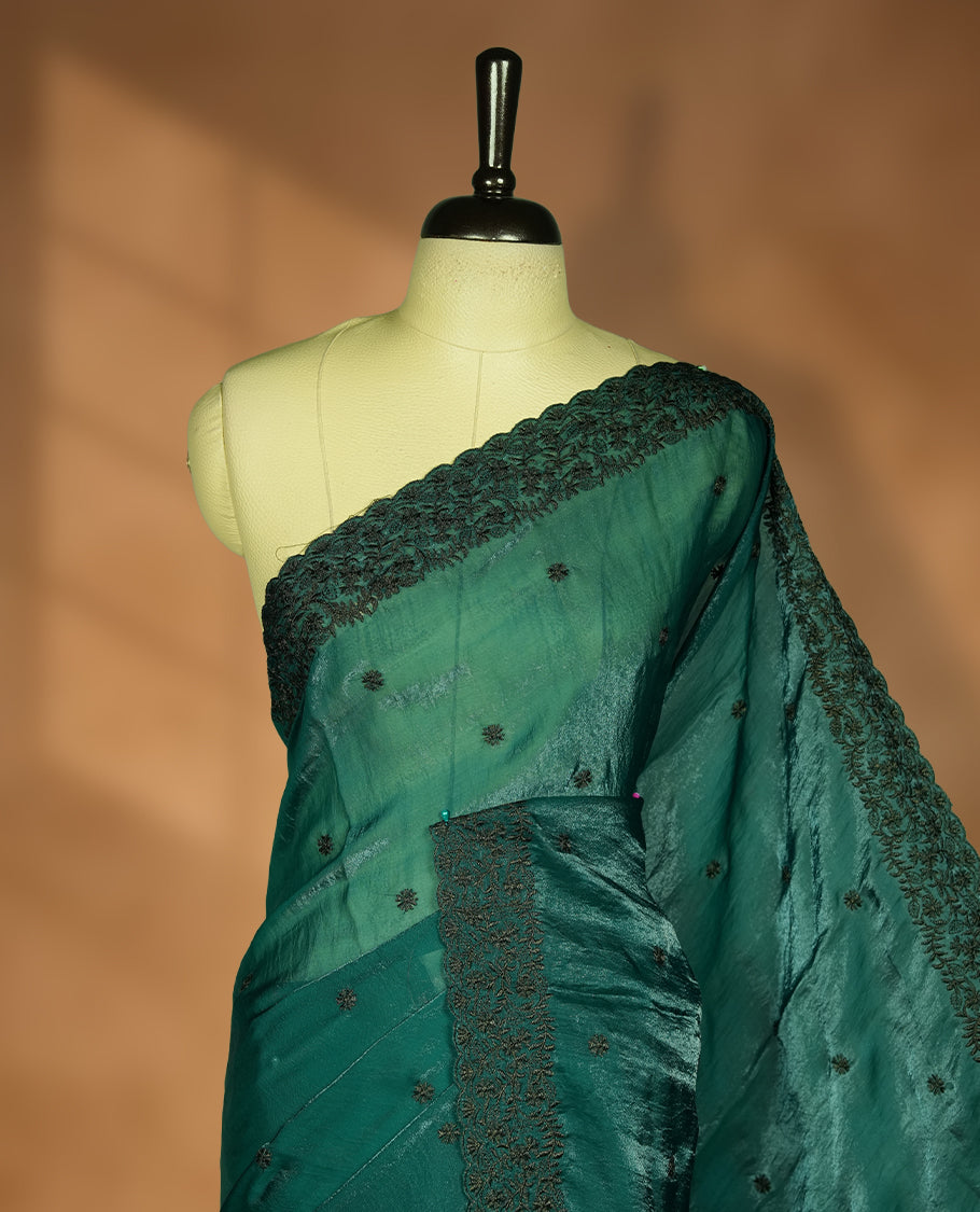 Dark green colour velvet chiffon saree featuring black colour thread embroidery pattern on body, border and paired with matching blouse piece.