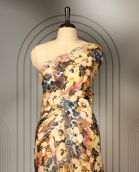 Yellow colour pure crepe saree with abstract floral print in earthy tones, highlighted by mirror work on the body and scalloped border, paired with a matching blouse.