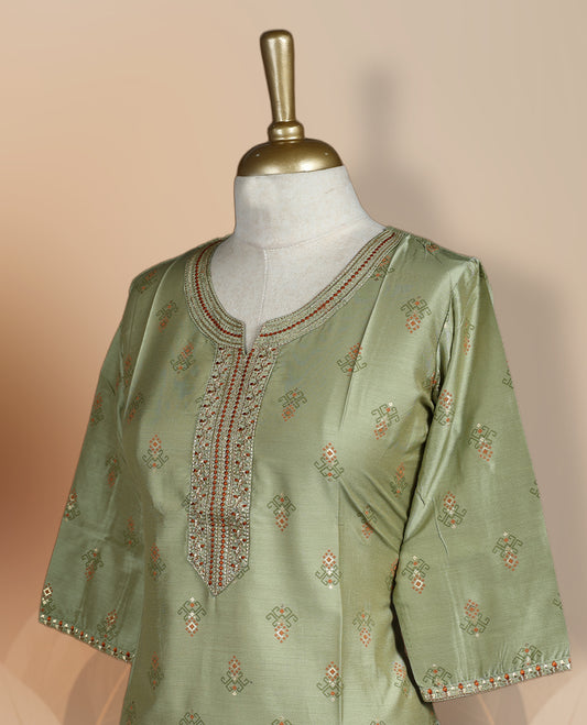 Light green colour kurti with intricate embroidered patterns, a round neckline with a detailed placket, and 3/4th sleeves, Perfect blend of traditional charm and modern comfort for all occasions.