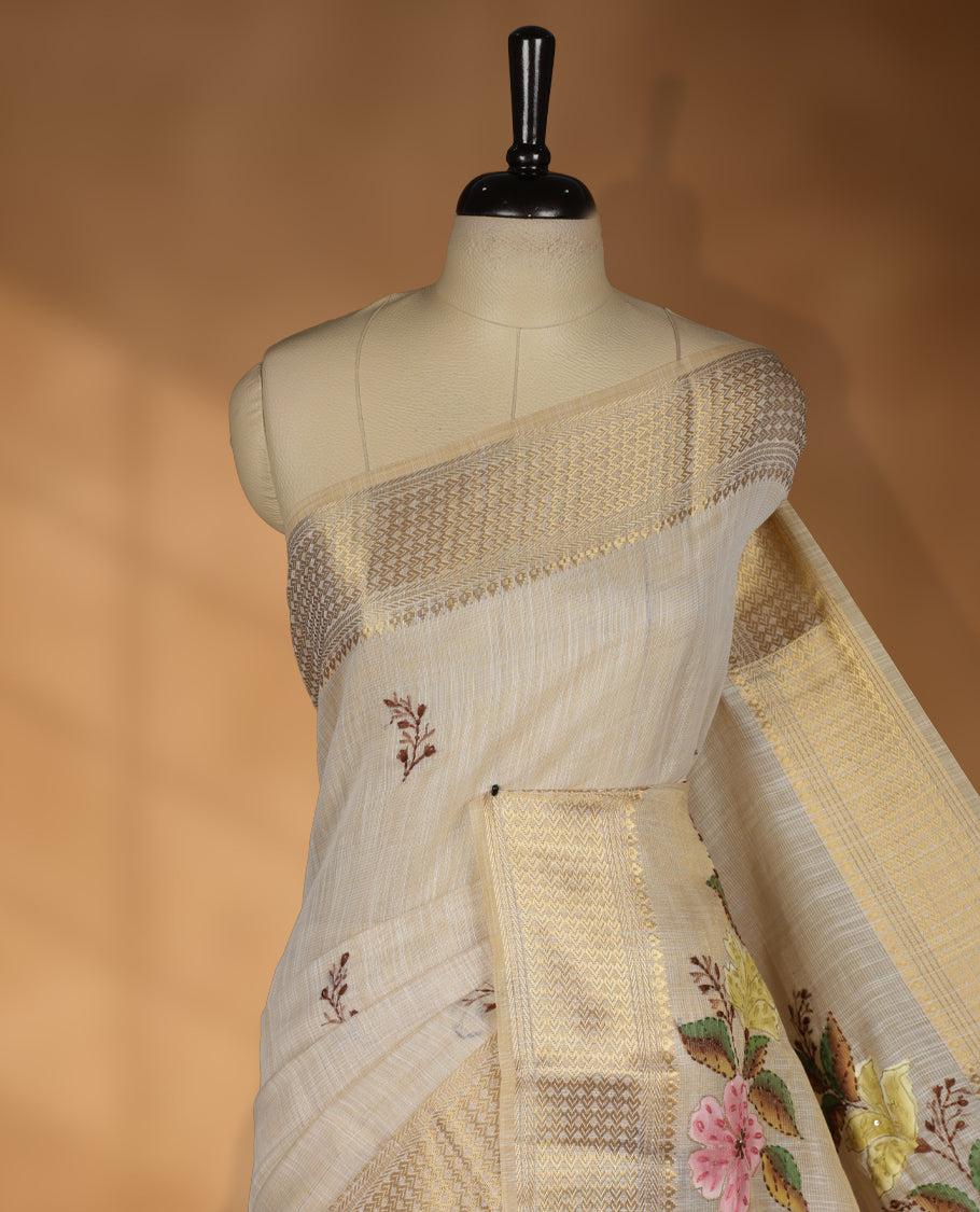 Beige colour Banarasi linen silk saree featuring hand brushed colour with Floral  & birds printed pattern on body, gold zari woven geometric design border with self colour pallu and comes with a matching blouse