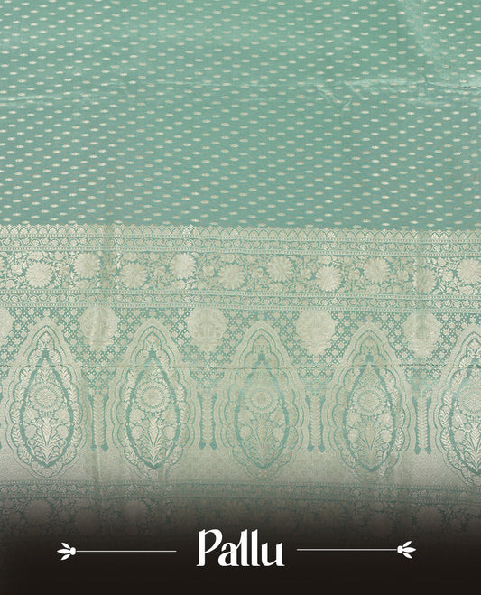 Pastel aqua colour banaras satin crepe saree fearturing gold tiny leaf motifs on body, kodi visiri pattern on border & pallu and paired with matching blouse