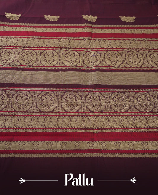 Deep maroon colour pure Kanchi cotton saree adorned with subtle beige zari motifs across the body,  The intricate zari woven border adds a touch of tradition & Includes a matching blouse piece for a complete look.