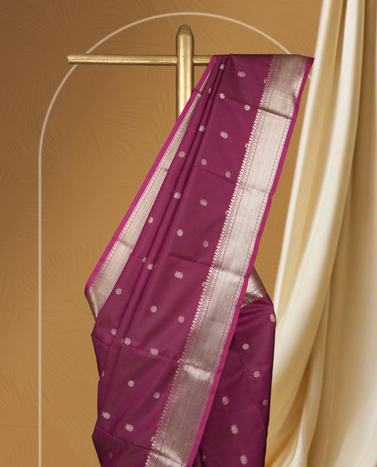Mulberry colour soft silk saree featuring fawn gold colour buttas and a lustrous fawn gold colour zari border with matching pallu & Paired with a matching blouse.