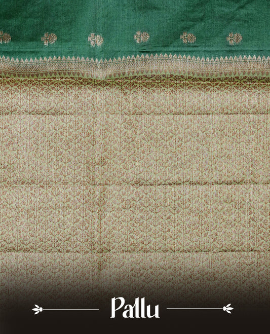 Dark green colour banaras silk saree featuring Gold zari buttas on body, complemented by contrast Light green colour border, comes with matching blouse piece.