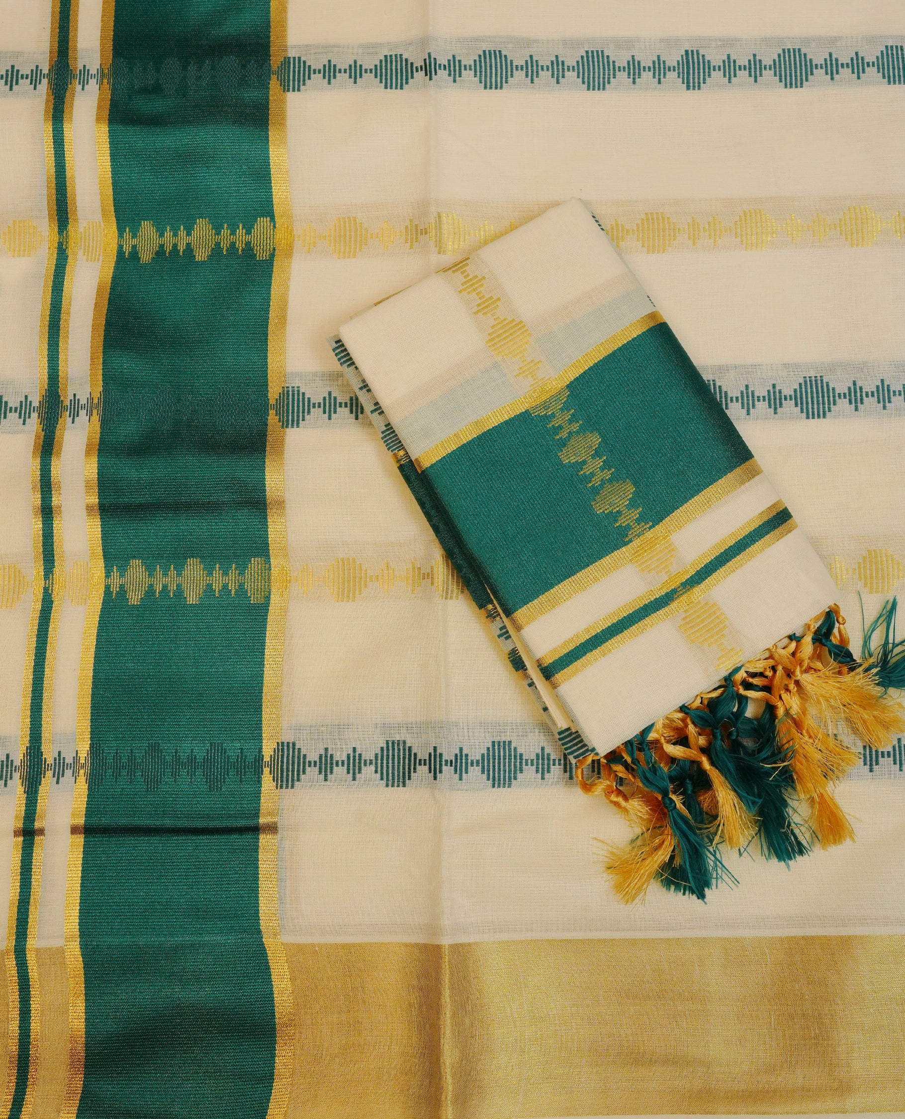 Cream colour cotton set mundu featuring Gold & teal colour strips on body, gold kasav with teal kara.