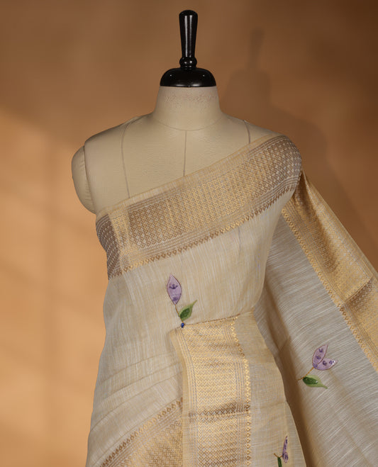 Beige colour Banarasi linen silk saree featuring hand brushed colour with Floral  & birds printed pattern on body, gold zari woven geometric design border with self colour pallu and comes with a matching blouse