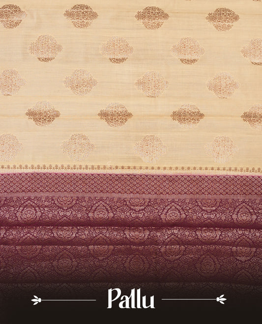Cream beige Banaras soft silk saree with gold zari oval motifs on body, with contrast Maroon colour floral pattern on pallu, border, and Matching blouse.