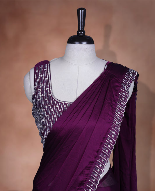 Elegant Grape colour ready to wear saree adorned with rich white stone and bead embroidery along the border and pallu, paired with a heavily embellished matching blouse for a grand festive look.