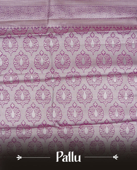 Lavender colour Semi tissue silk saree featuring Light gold zari kodi floral motifs on body, Contrast Purple colour with traditional border, paired with matching blouse piece.