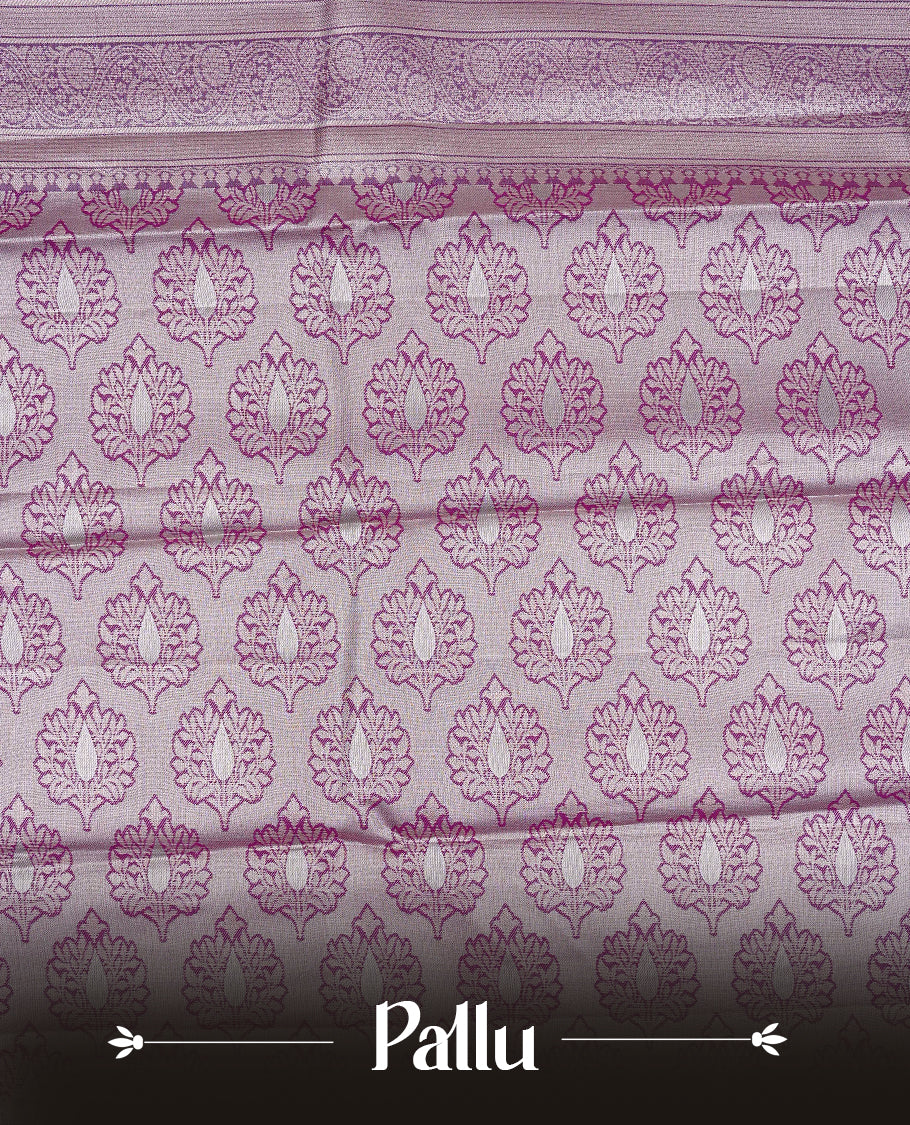 Lavender colour Semi tissue silk saree featuring Light gold zari kodi floral motifs on body, Contrast Purple colour with traditional border, paired with matching blouse piece.