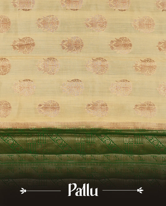Cream beige Banaras soft silk saree with gold zari oval motifs on body, with contrast green colour floral pattern on pallu, border, and Matching blouse.