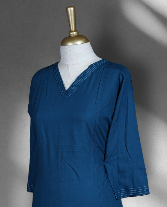 Cobalt blue colour cotton cord set with a straight cut kurta featuring a V neckline and 3/4th sleeves, paired with flared bottoms.