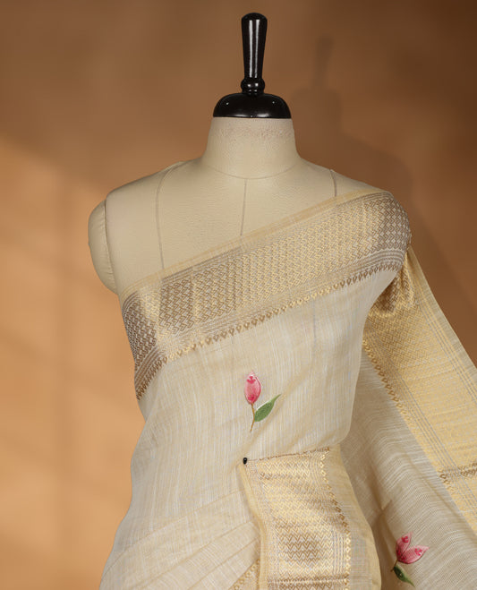 Beige colour Banarasi linen silk saree featuring hand brushed colour with Floral  & birds printed pattern on body, gold zari woven geometric design border with self colour pallu and comes with a matching blouse