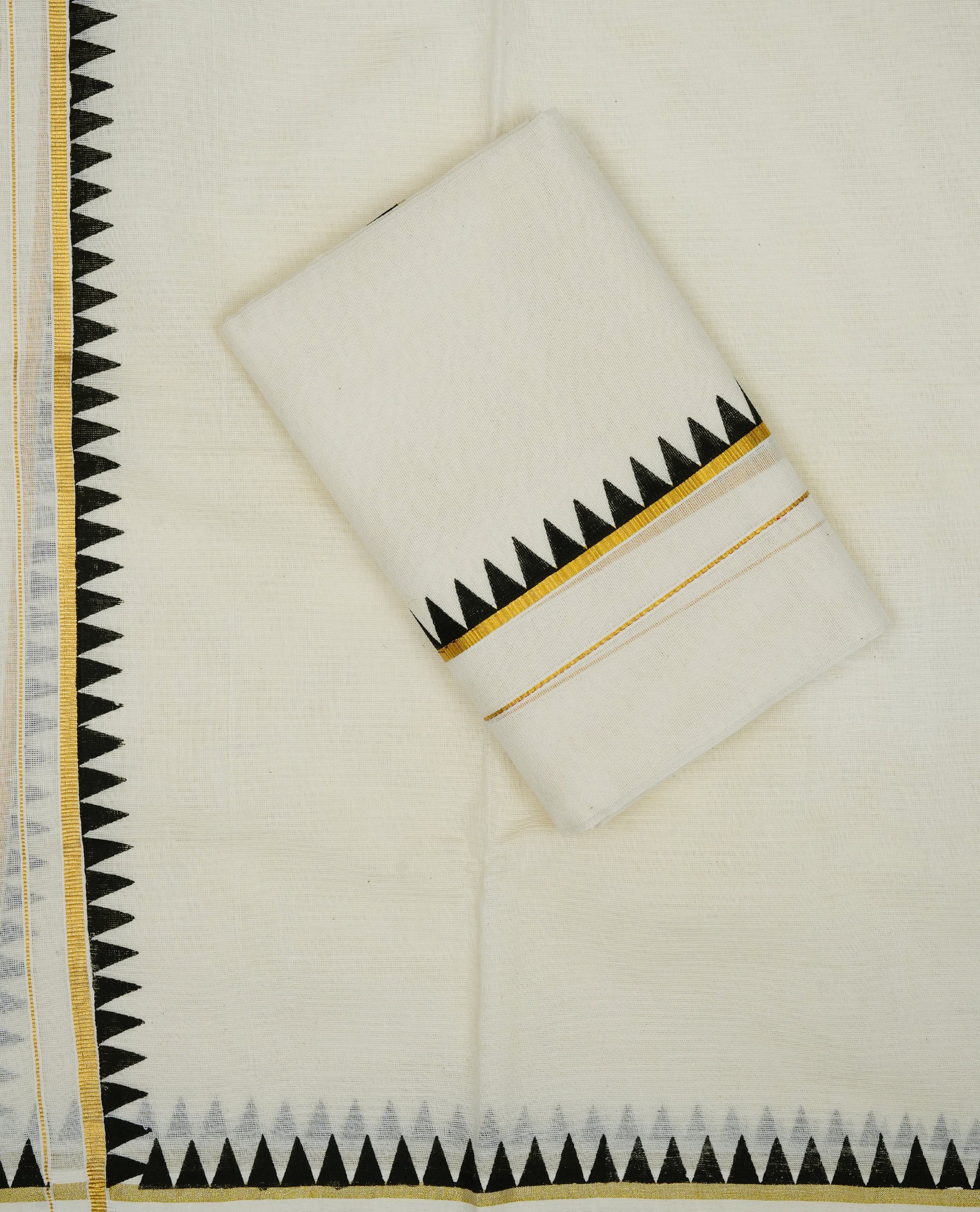 Cream colour cotton set mundu featuring gold zari with black temple printed border.