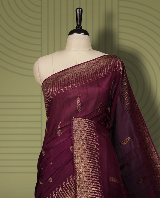 Grape colour semi Banarasi Tussar Georgette saree with delicate gold zari buttas on the body, a rich golden zari pallu, and detailed woven border & Comes with a matching blouse piece.