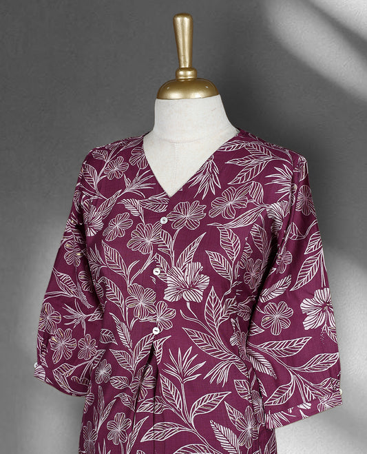 Onion pink colour cord set featuring a floral printed top with a V neck and button detailing, paired with solid onion pink pants.