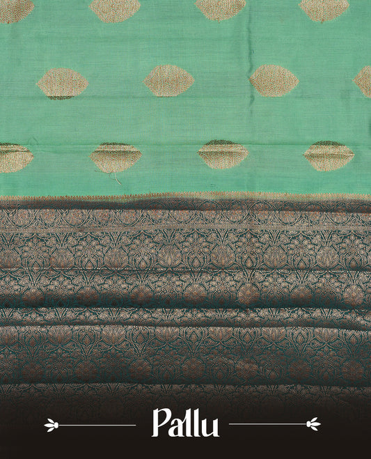 Aqua green Banaras soft silk saree with gold zari oval motifs on body, with contrast Dark Teal colour floral pattern on pallu, border, and Matching blouse.