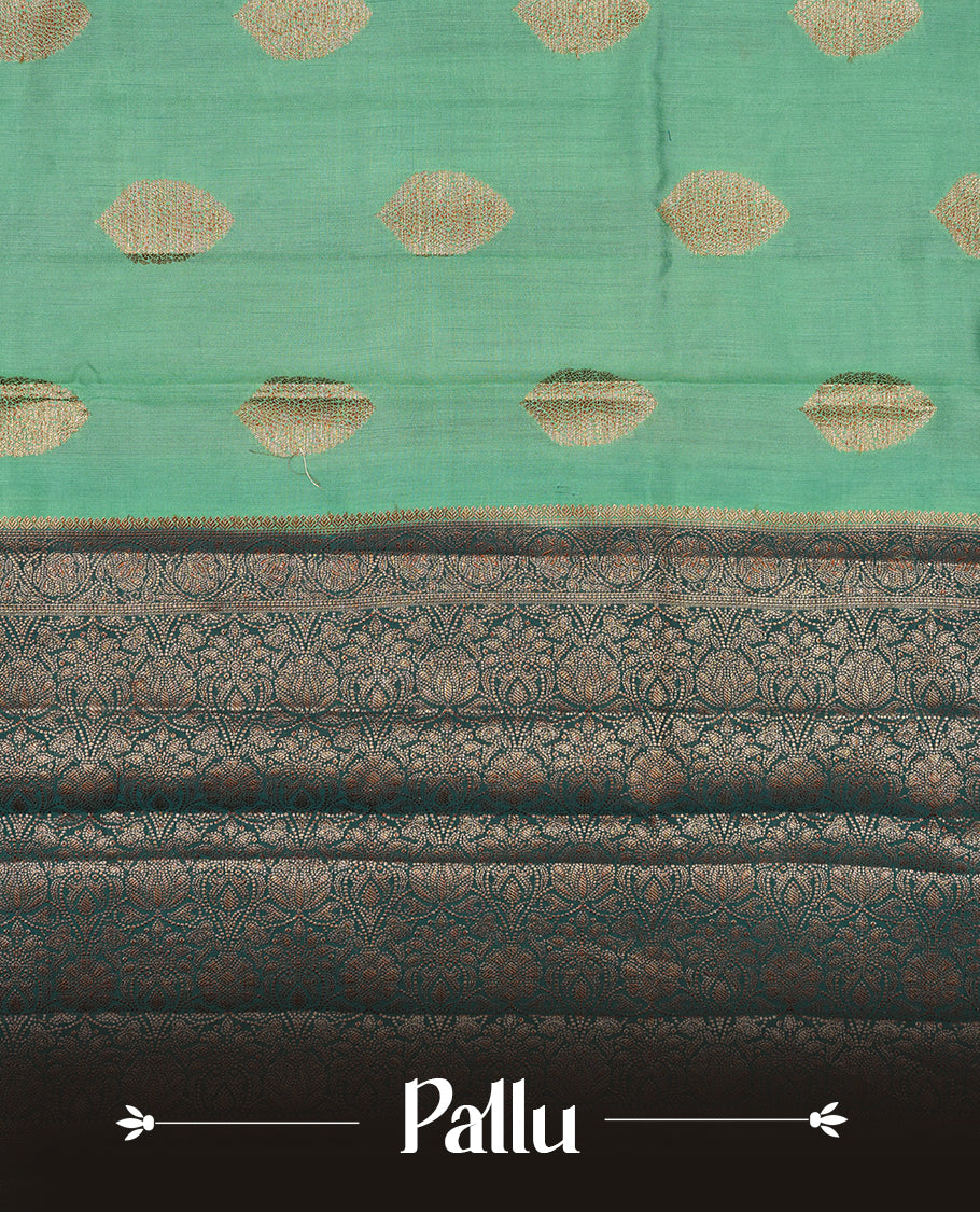 Aqua green Banaras soft silk saree with gold zari oval motifs on body, with contrast Dark Teal colour floral pattern on pallu, border, and Matching blouse.