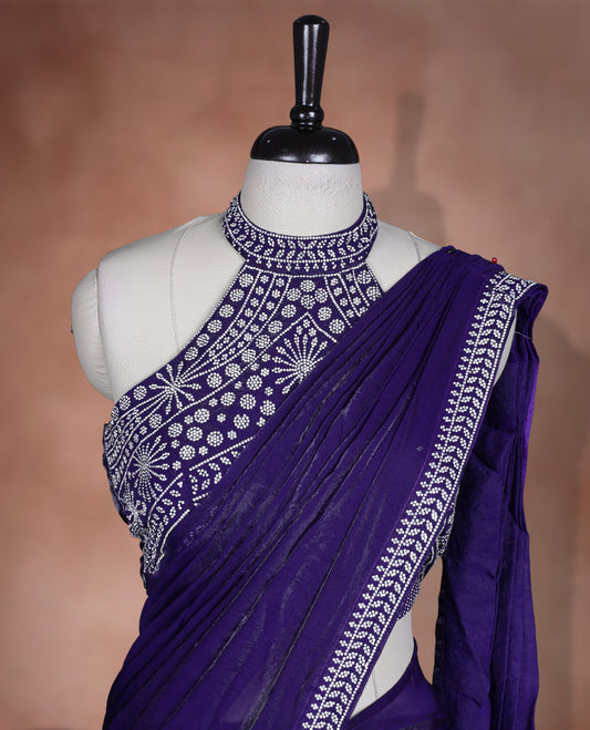 Elegant Dark purple colour ready to wear saree adorned with rich silver stone embroidery along the border and pallu, paired with a heavily embellished matching blouse for a grand festive look.