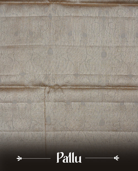 Beige Colour banaras saree featuring Light gold zari Floral kodi pattern on body, complemented by borderless finish, comes with matching blouse piece.