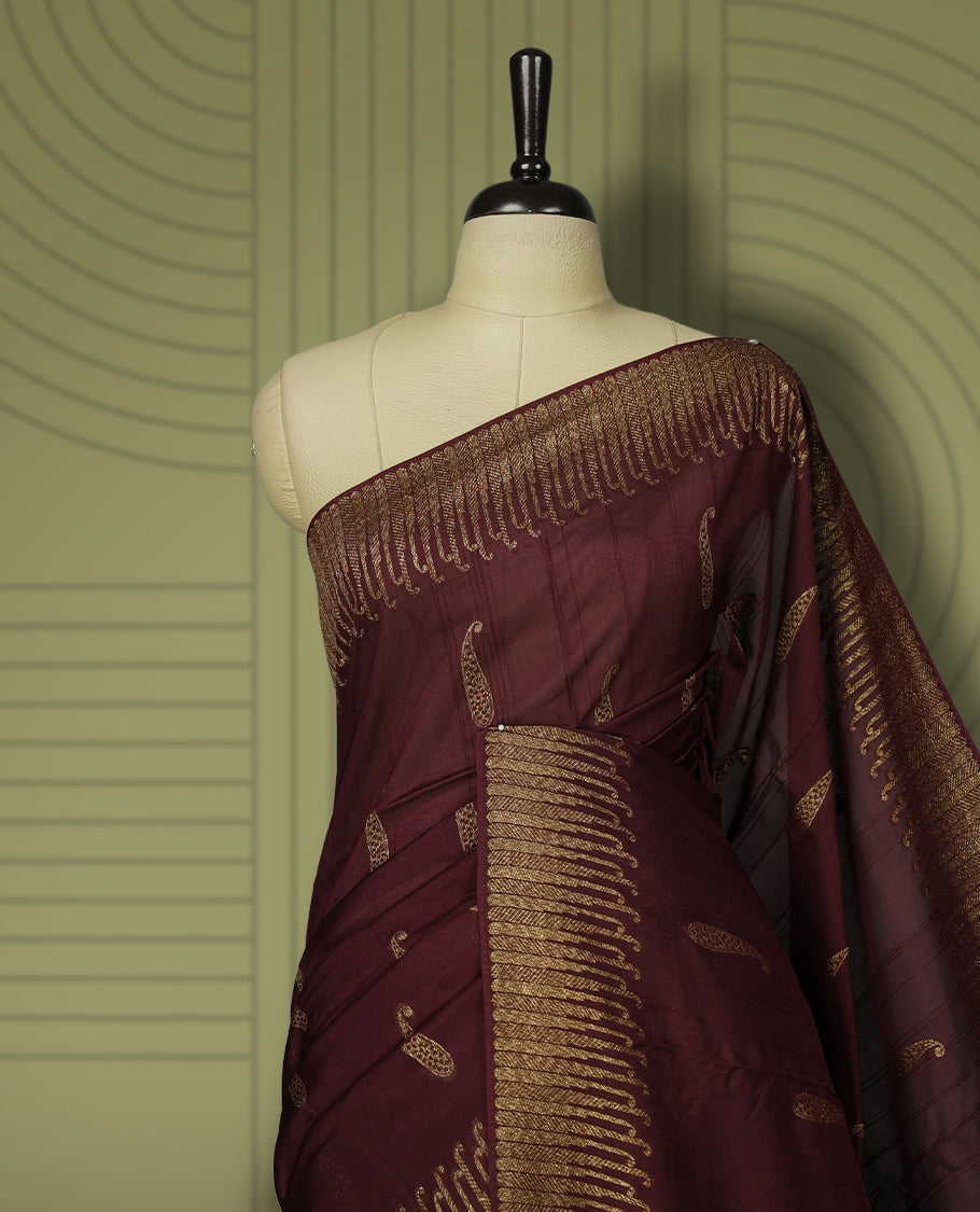 Dark coffee brown colour semi Banarasi Tussar Georgette saree with delicate gold zari buttas on the body, a rich golden zari pallu, and detailed woven border & Comes with a matching blouse piece.