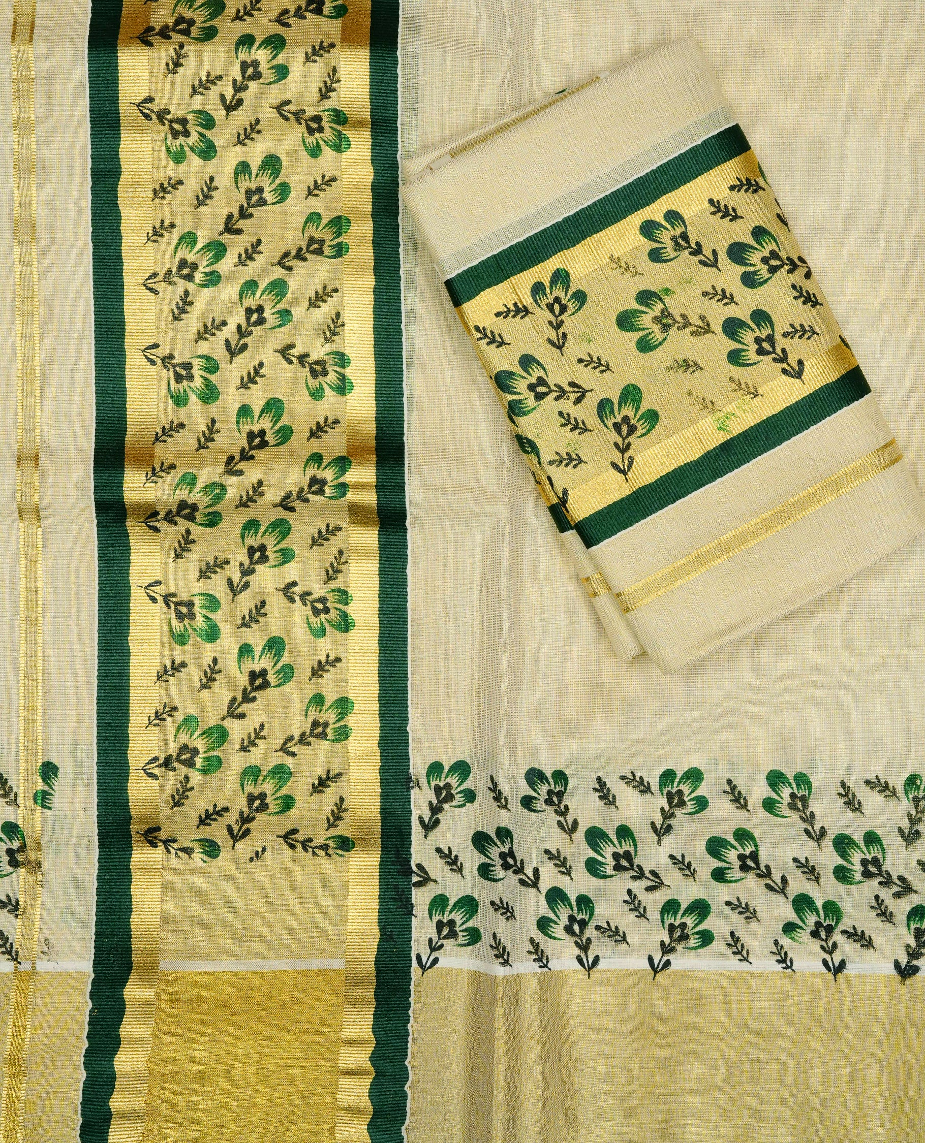 Cream Colour tissue set mundu featuring a plain body, enhanced with elegant green floral motifs an a rich gold zari kara