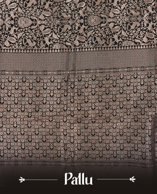 Black colour Mysore Crepe Silk saree fearturing gold Zari kodi visiri & Animal brocade pattern on body and self colour border paired with matching blouse