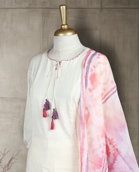Off white colour salwar from TWARA, featuring a delicate pink & purple embroidered neck with thread work, paired with a matching bottom and an pink floral printed dupatta.