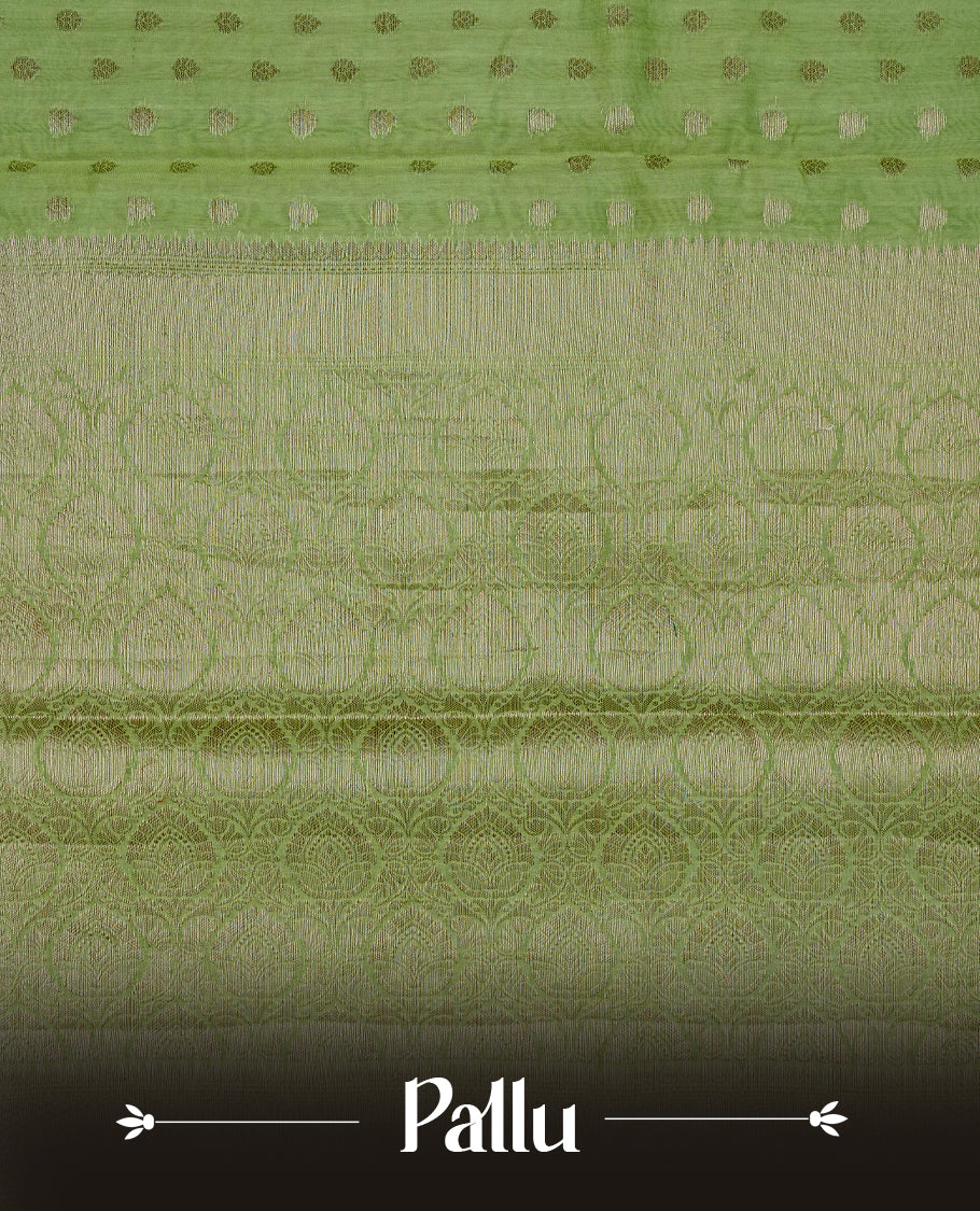 Pastel green colour banaras saree featuring Gold zari buttas on body, complemented by self colour with simple zari border, comes with matching blouse piece.