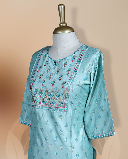 Light blue silk blend kurthi with intricate embroidered yoke, subtle butti prints, and elbow length sleeves & A perfect blend of tradition and style for festive or casual wear.