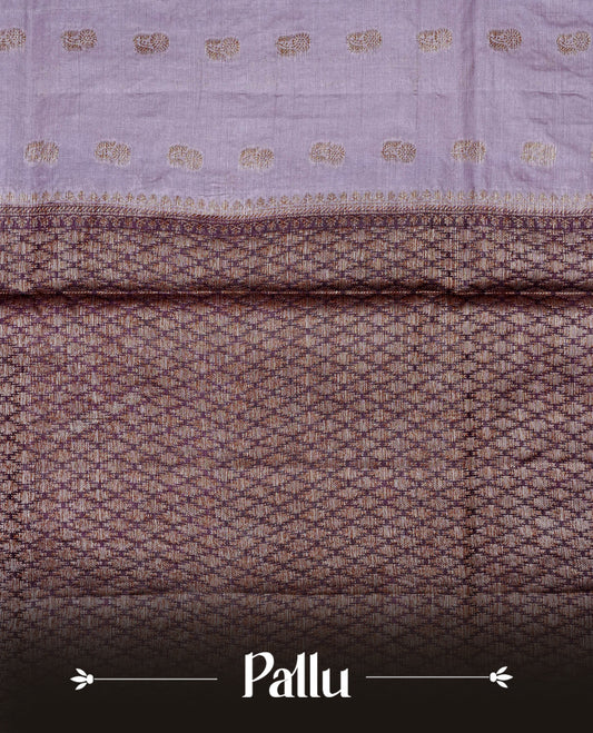 Light purple colour banaras silk saree featuring Gold zari buttas on body, complemented by contrast Purple colour border, comes with matching blouse piece.