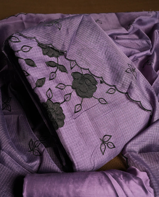 Purple colour churidhar material featuring Black colour thread embroidery on the front panel, self colour dupatta with elegant border, and matching plain bottom