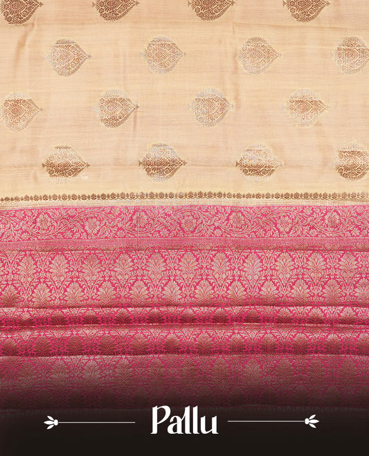 Cream beige Banaras soft silk saree with gold zari oval motifs on body, with contrast Pink colour floral pattern on pallu, border, and Matching blouse.