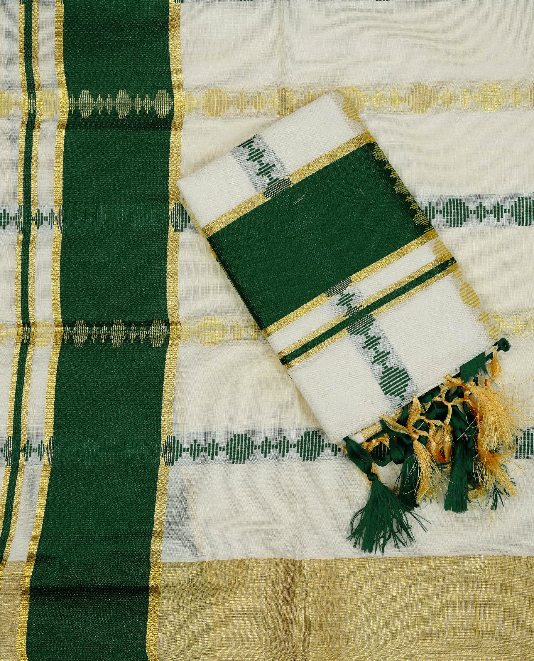 Cream colour cotton set mundu featuring Gold green colour strips on body, gold kasav with green kara.