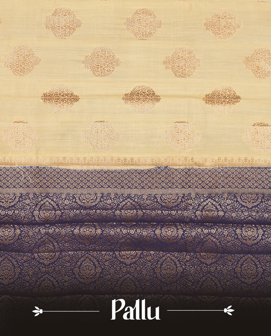 Cream beige Banaras soft silk saree with gold zari oval motifs on body, with contrast Blue colour floral pattern on pallu, border, and Matching blouse.