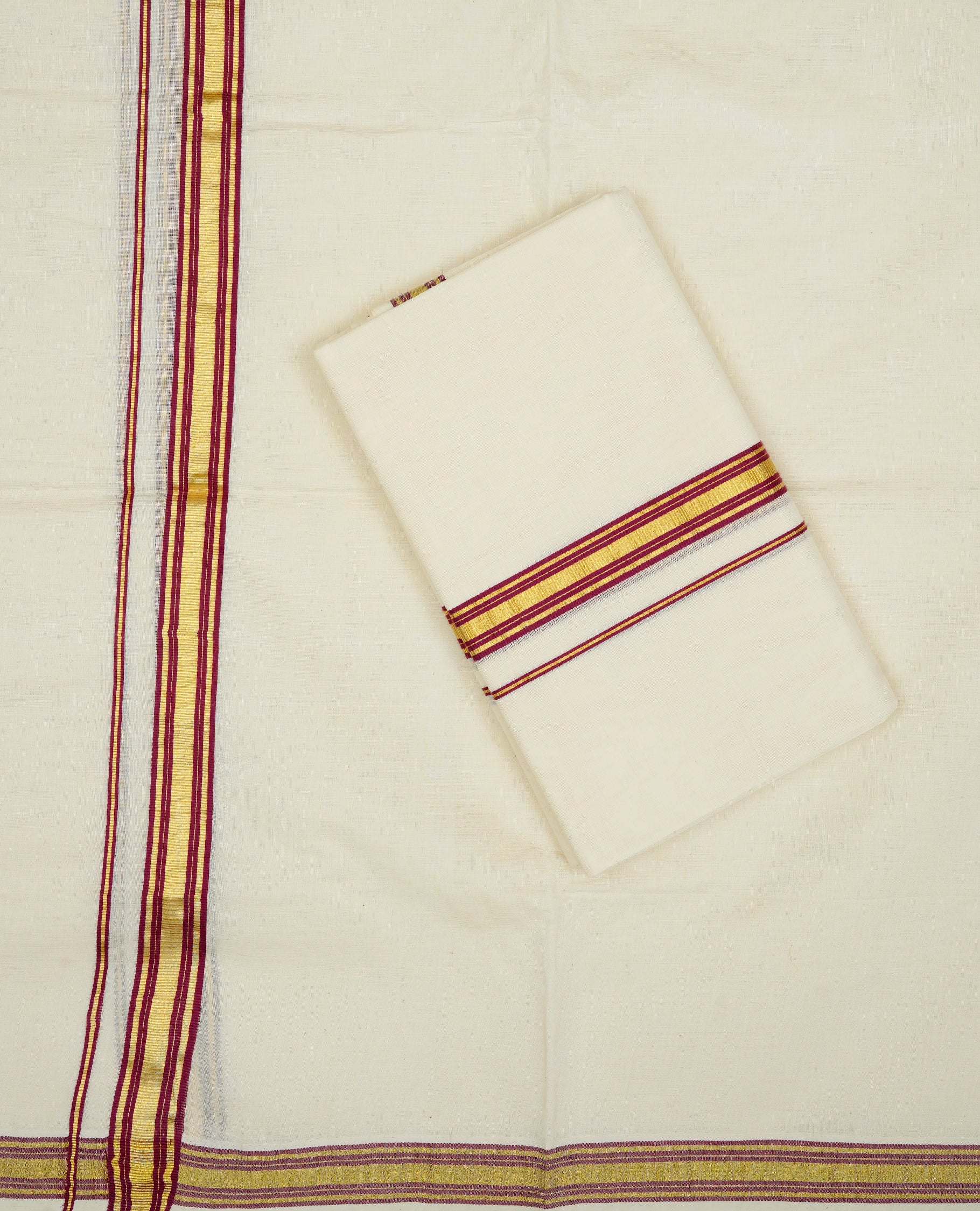 Cream colour cotton Set Mundu With Plain body, enhanced With Maroon & gold zari kara.