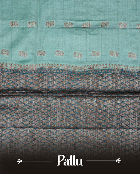 Light Aqua colour banaras silk saree featuring Gold zari buttas on body, complemented by contrast teal colour border, comes with matching blouse piece.