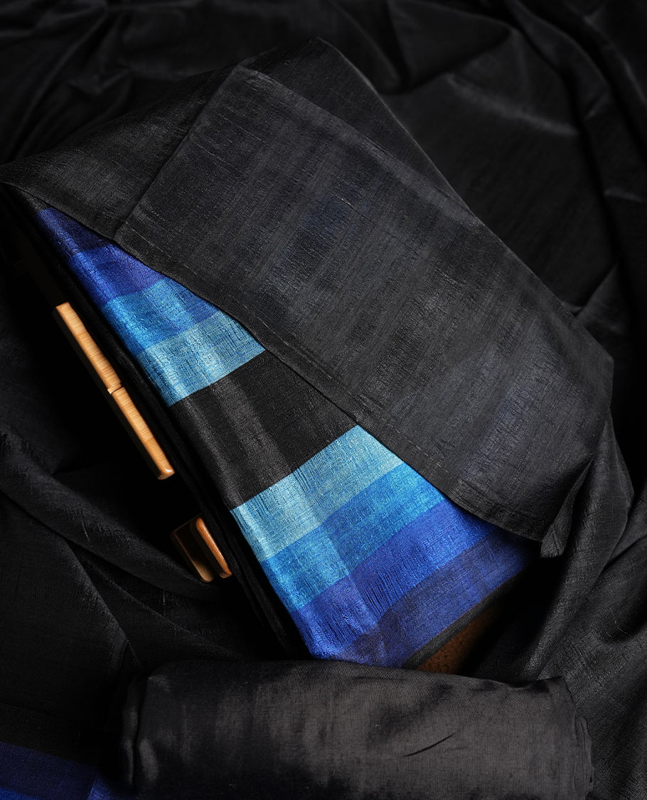 Black colour churidhar material featuring elegant horizontal stripes on the yoke and dupatta, woven in shades of Blue and Black & Paired with a matching plain bottom