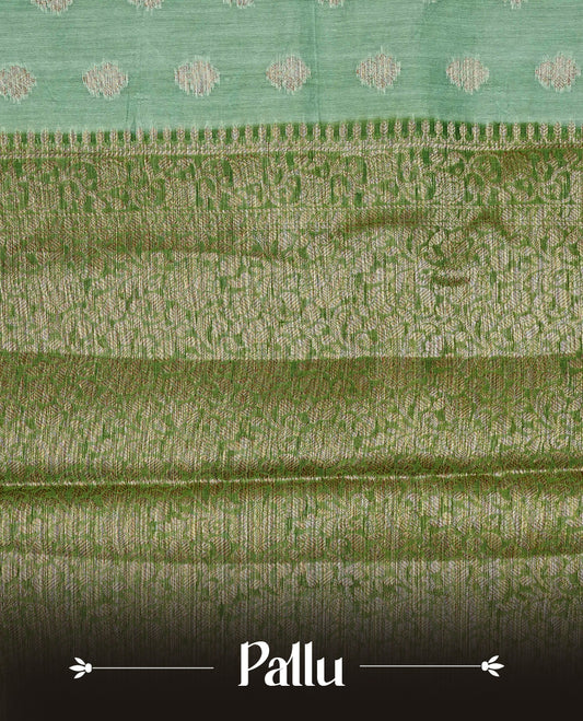 Pista green colour banaras silk saree featuring gold zari buttas on body, complemented by contrast Dark green with gold zari border, comes with matching blouse piece.